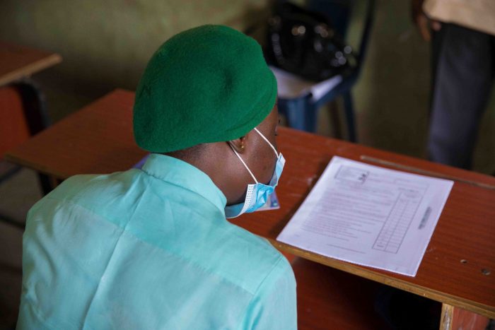 Student reading instructions before the commencement of a paper