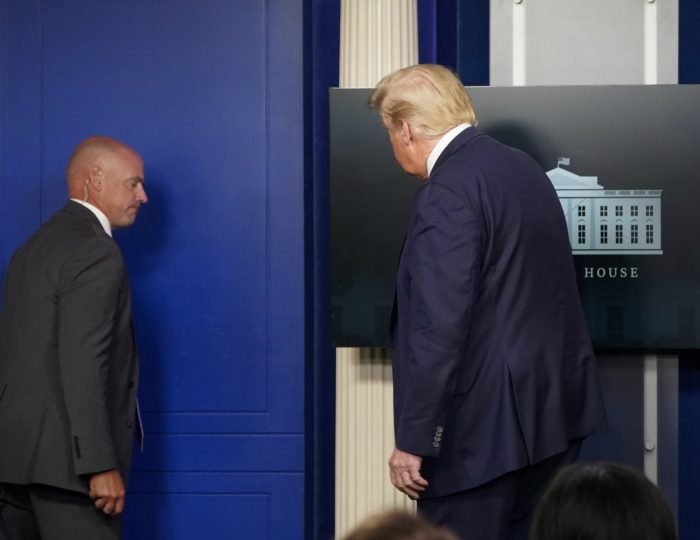 Trump being taken out of the press briefing toom on Monday
