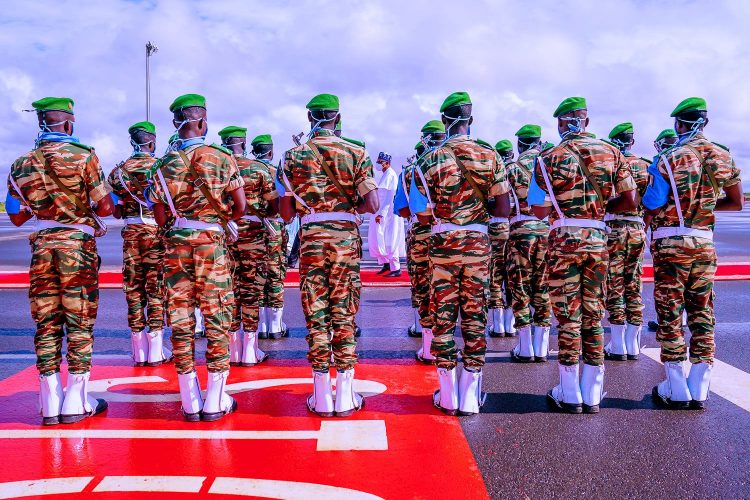 Buhari inspecting guard of honour on arrival at Niger Republic