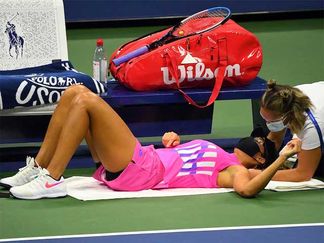 Madison Keys being treated on-court for neck injury