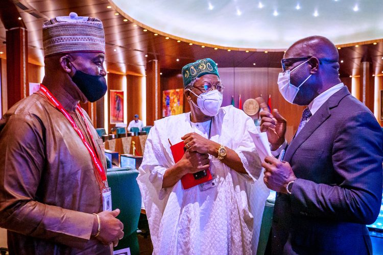 Obaseki with Lai Mohammed and another member of Buharis cabinet.