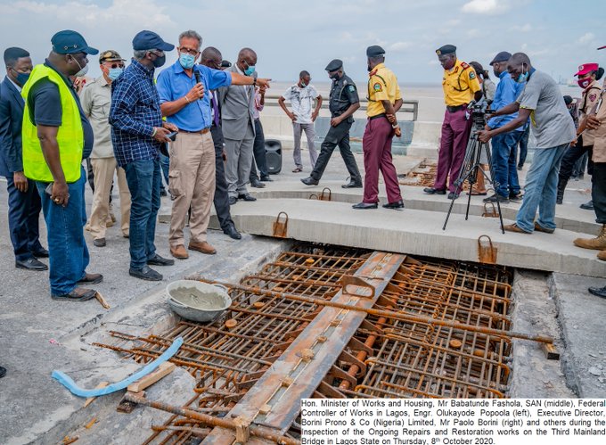 Fashola, 2nd left with engineers fixing Third Mainland Bridge in Lagos