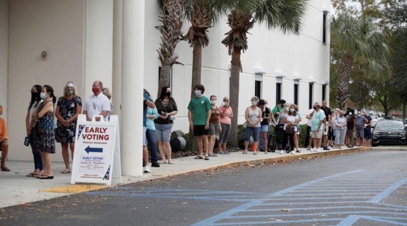 People queue for early voting in Pinella county Largo, Florida