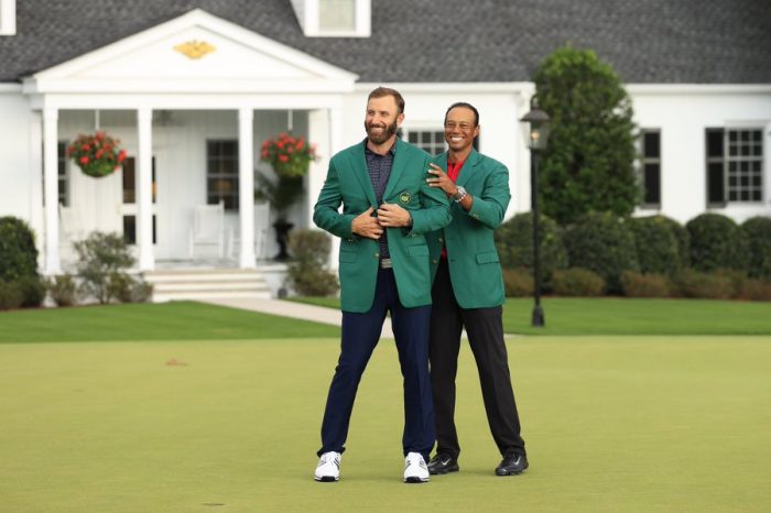 Dustin Johnson with Tiger Woods in the Augusta Masters Green jacket