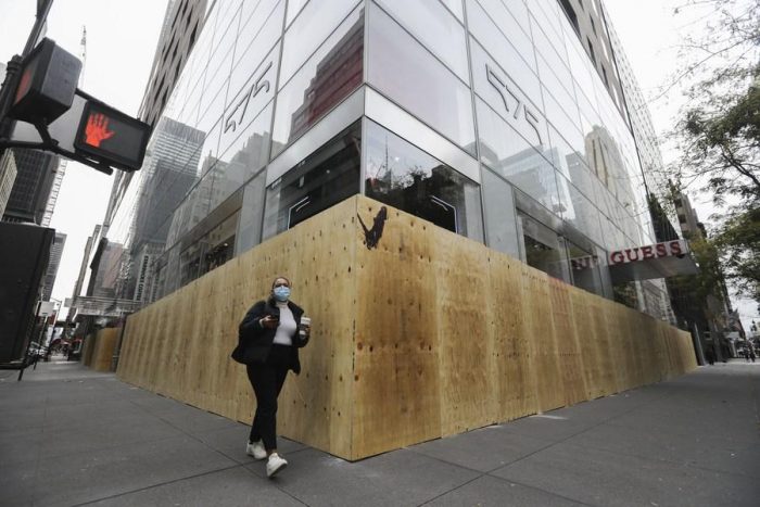 a boarded store on the Fifth Avenue in New York. Photo credit: Xinhua