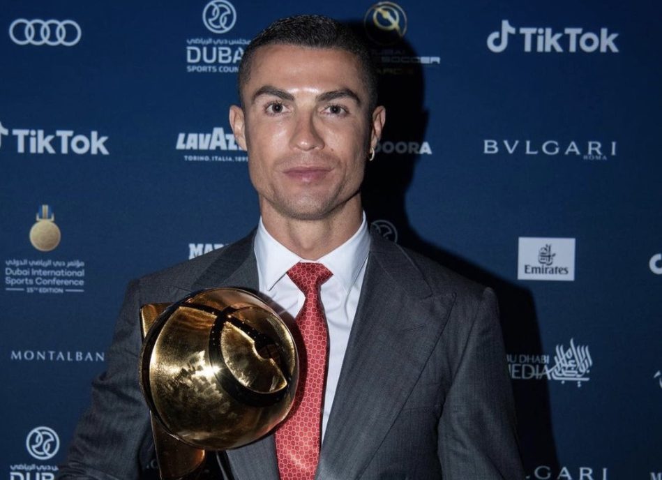 Cristiano Ronaldo with the player of the century trophy