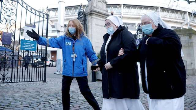 An infected nun arrives for treatment in a UK hospital