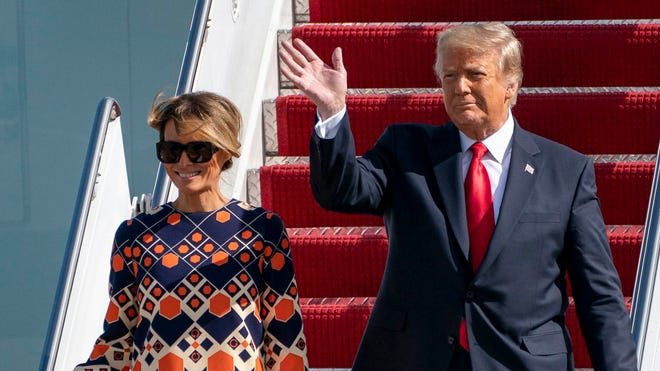 Melania with Donald Trump on arrival in Palm Beach. She rebuffed him for one last photo as First Lady