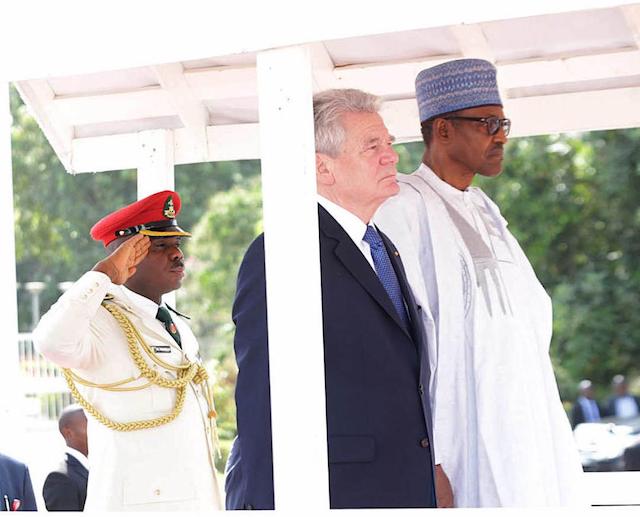 On duty, Aide-de-camp Mohammed Abubakar with President Buhari, right