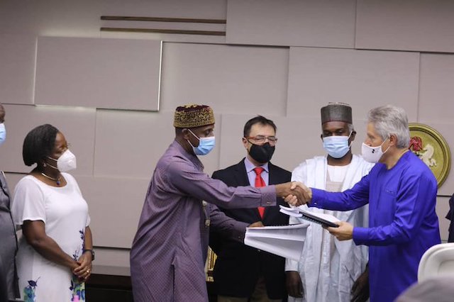 Transport Minister Amaechi and Antonio Gvoea, MD of Mota-Engil exchange contract papers