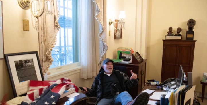 Trump thug Richard Barnett in Nancy Pelosi’s office on Wednesday