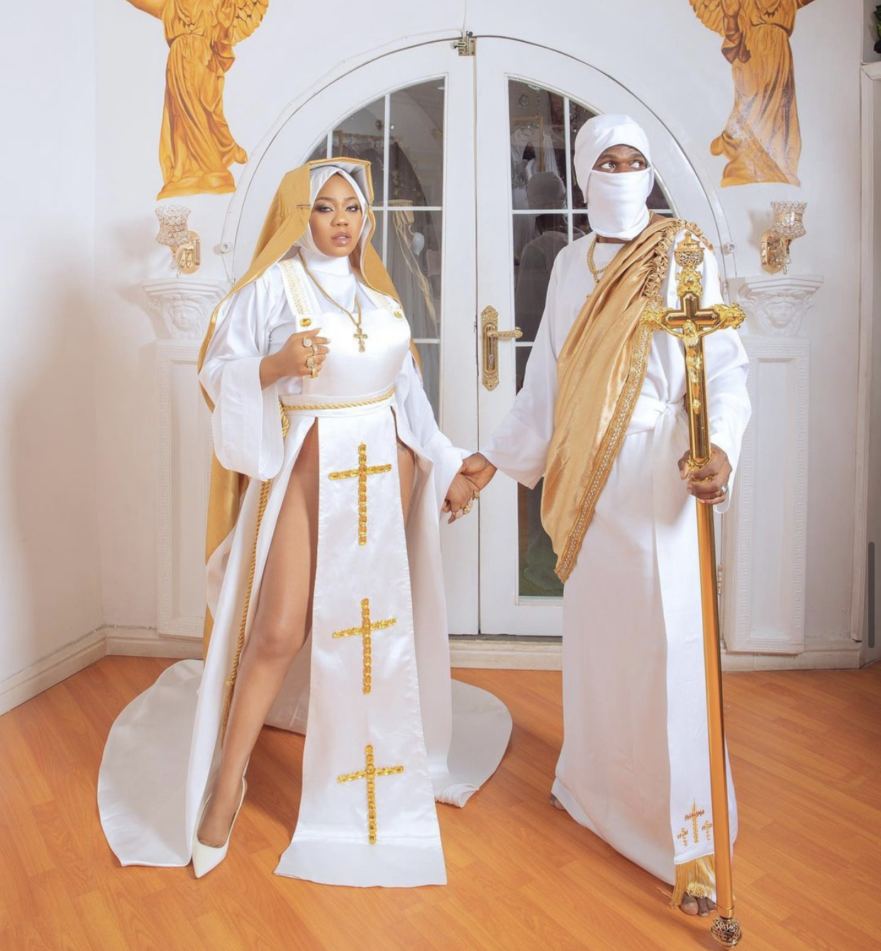 Toyin Lawani and a man in their controversial nun outfit