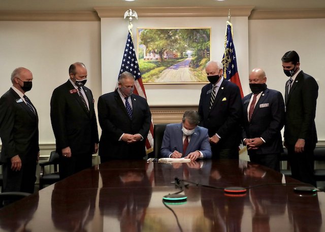 Georgia governor Brian Kemp signing the voting restrictive law on Thursday