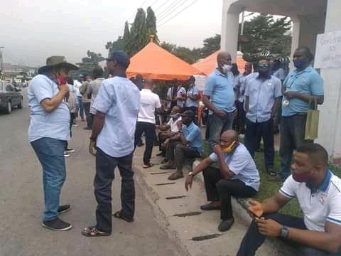 Members of Parliamentary Staff Association of Nigeria, PASAN at the gate to Rivers House of Assembly