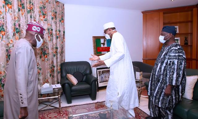 Have your seat: Buhari gestures to Tinubu