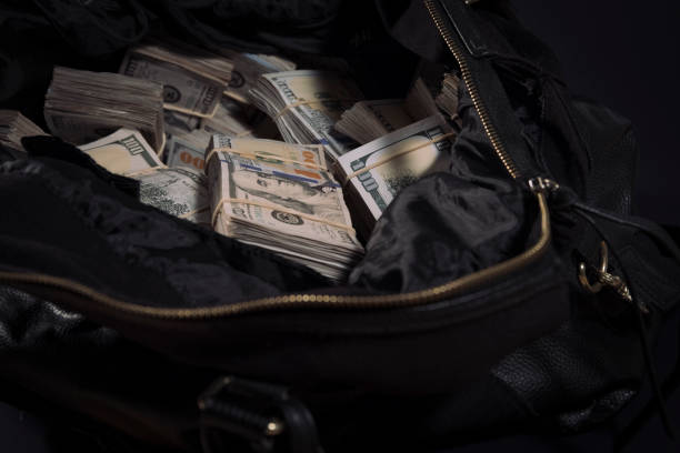 Leather bag with lots of 100 dollar bills