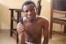 Kogi Polytechnic student, Shehu Mohammed holding the locally made gun found in his possession