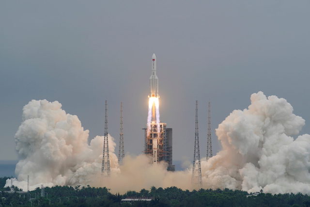 FILE PHOTO: Long March-5B Y2 rocket, carrying the core module of China’s space station Tianhe, takes off from Wenchang