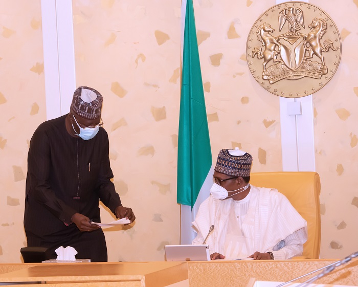 President Muhammadu Buhari Confers with the SGF Mr. Boss Mustapha during a virtual FEC Meeting held at the State House Abuja. PHOTO; SUNDAY AGHAEZE. MAY 5TH 2021