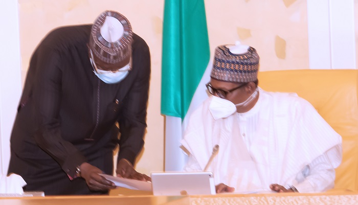 President Muhammadu Buhari Confers with the SGF Mr. Boss Mustapha during a virtual FEC Meeting held at the State House Abuja. PHOTO; SUNDAY AGHAEZE. MAY 5TH 2021