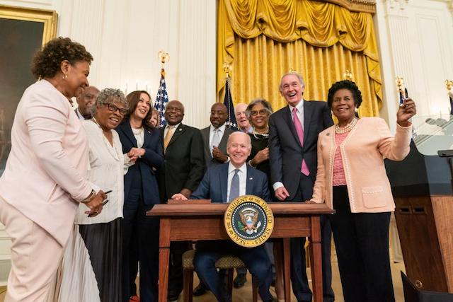 Biden, VP Harris and Congressmen and women at the signing ceremony in Washington D.C.