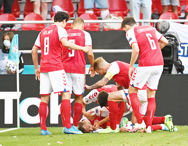 Eriksen collapses on the pitch as horrified team mates watch