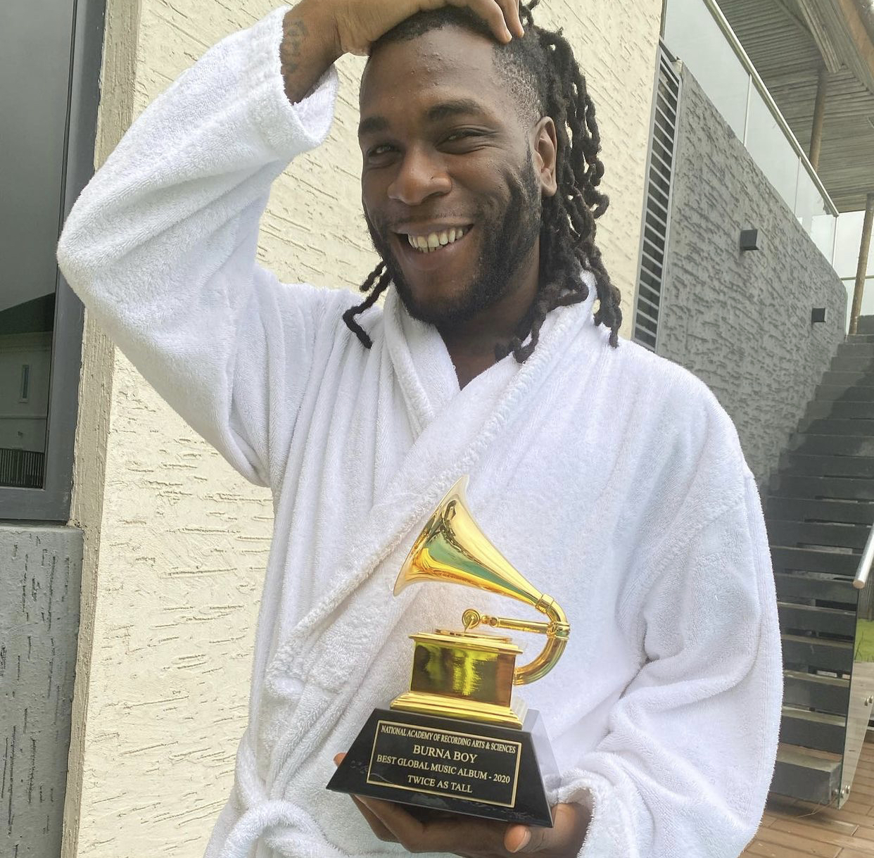 Burna Boy receives his Grammy Award trophy P.M. News