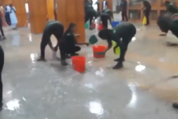National Assembly cleaners mop rain drenched area of the Senate