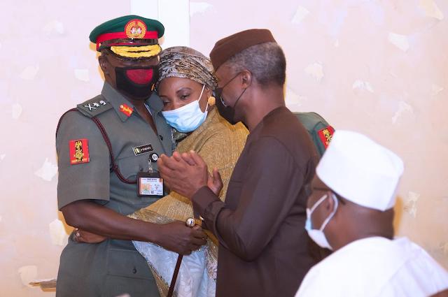 Lt.General Faruk Yahaya with his wife, cheered by Osinbajo