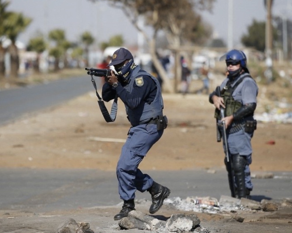 South Africa policemen target rioters