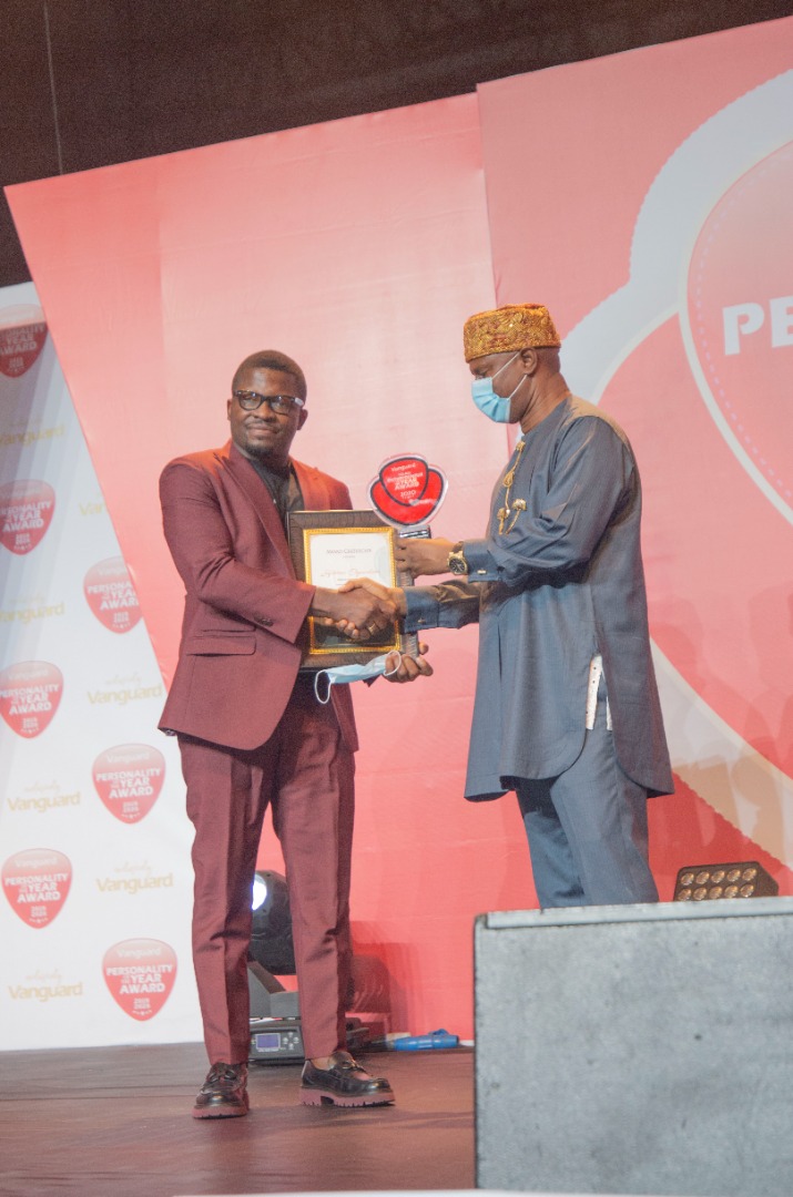 Sijibomi Ogundele receiving his award at the Eko Hotel and Suites, Lagos in a grand ceremony