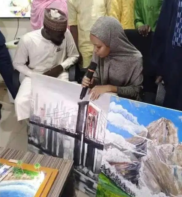 Amina Abdullahi with her paints