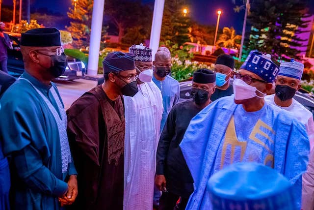 Buhari welcomed to  the dinner by his guests 
