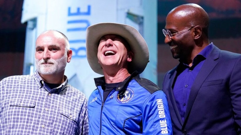 Jeff Bezos, middle, with Van Jones, right and Jose Andres