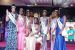 2021 Queen of Peace, Nigeria, Miss Ajuma Abah (fitted) surrounded by the other winners