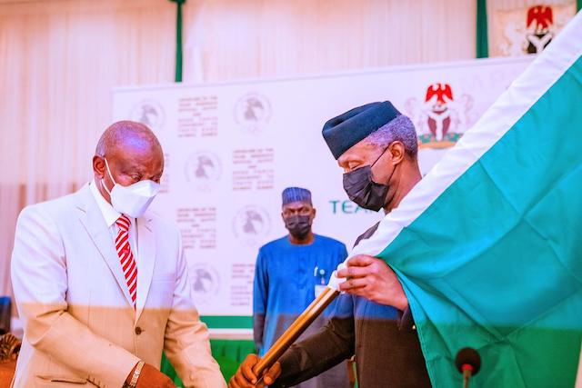 Vice President Yemi Osinbajo  hands over the national flag to Team Nigeria going for  2020 Tokyo  Olympic