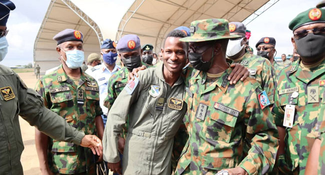 Flight Lieutenant Abayomi Dairo with the Chief of Defence Staff, Lucky Irabor, and other military officials.
