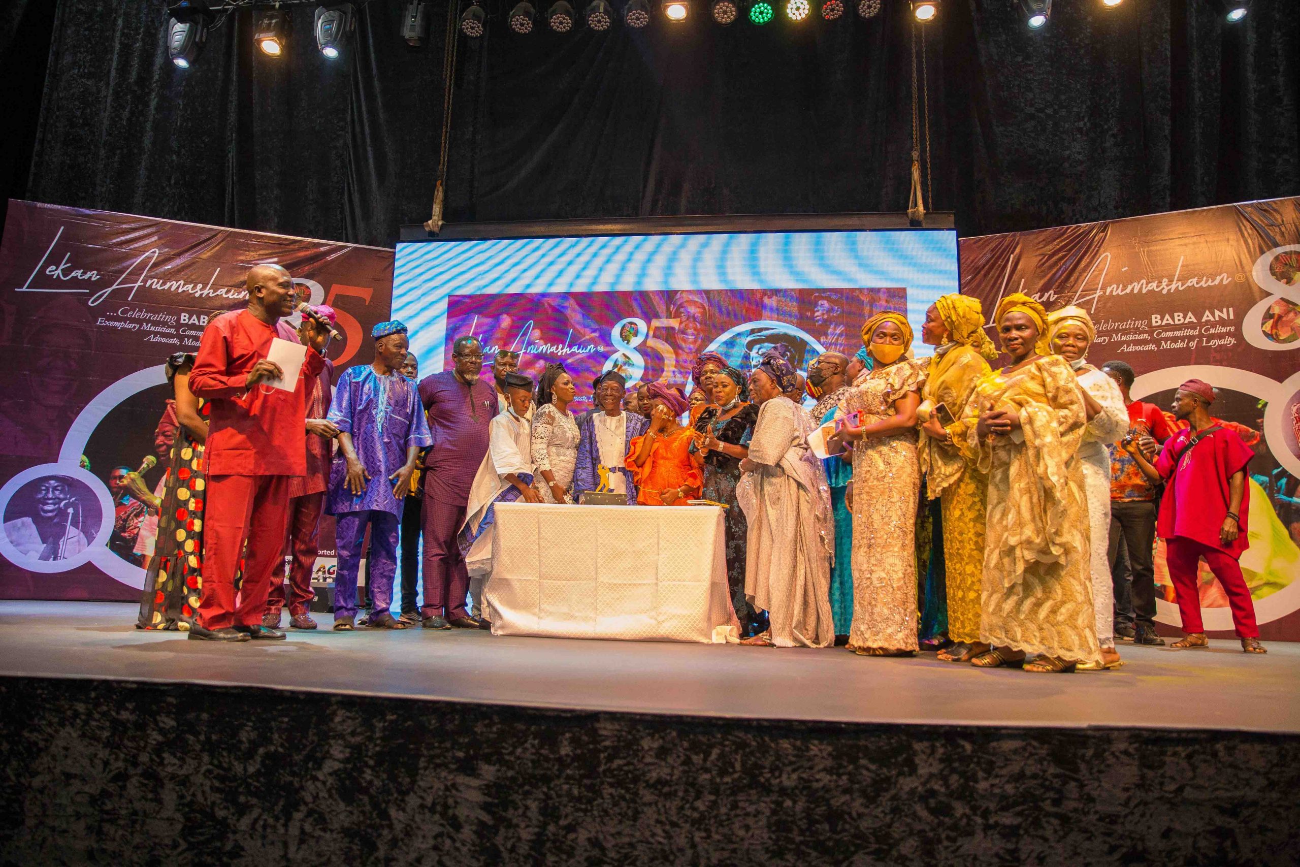 Family members and friends of Baba Ani joined him on stage to cut his birthday cake. Photo by Ayodele Efunla