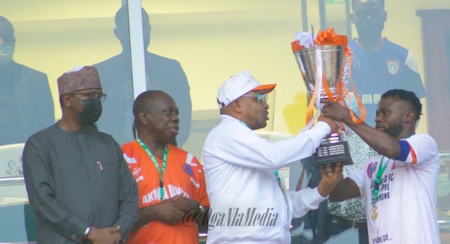 Akwa United captain, Otobong Effiong receives the NPFL cup