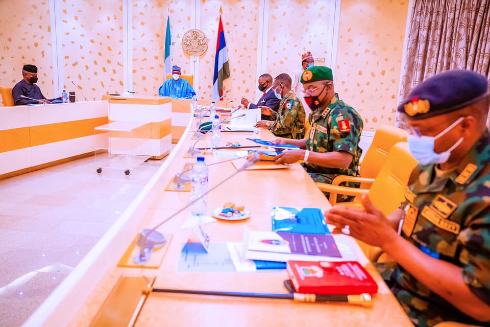 The president with security chiefs at the meeting