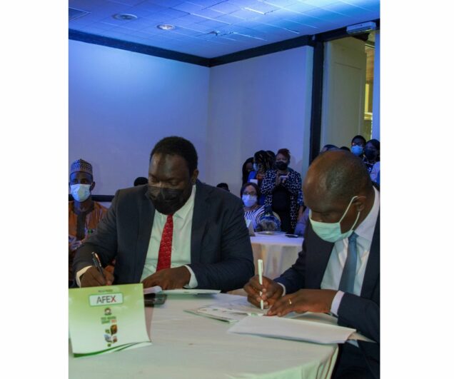 L – R AFEX CEO Ayodeji Balogun and SWAgCo MD BabajideArowosafe while signing the signing ceremony at the deal room of the Feed Nigeria Summit 2021.