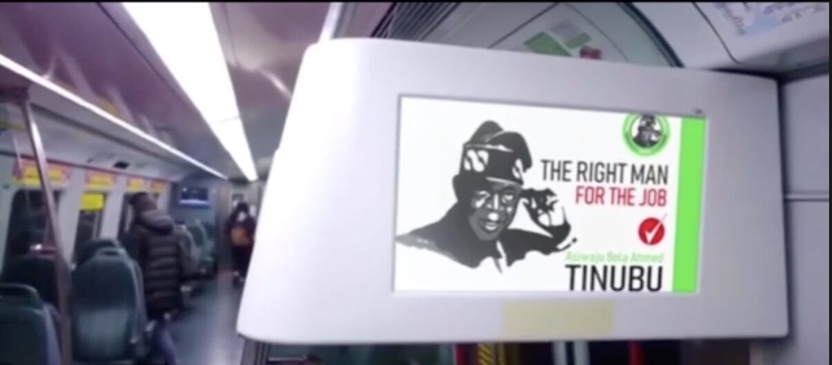 A Tinubu poster in a train coach