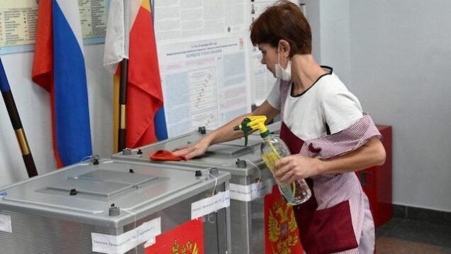 A woman votes in the Russian election