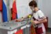 A woman votes in the Russian election