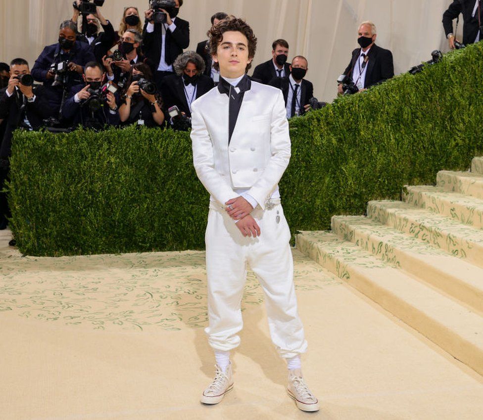 Actor Timothée Chalamet donned a white silk suit by Haider Ackermann - a look described as "formal sweatpants