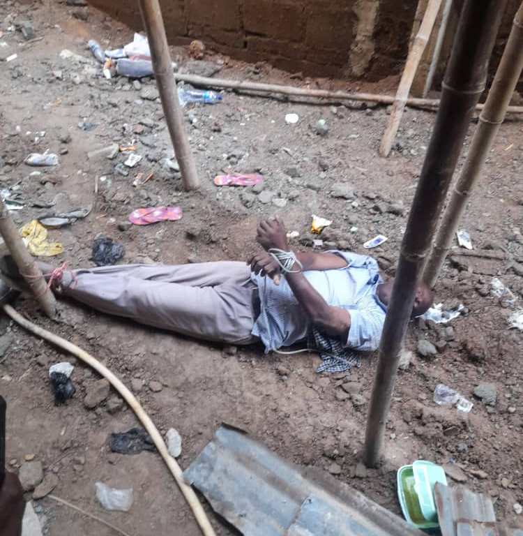 Alozie tied to a stake