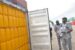 File: Customs officials examine a container at Tin Can Island port