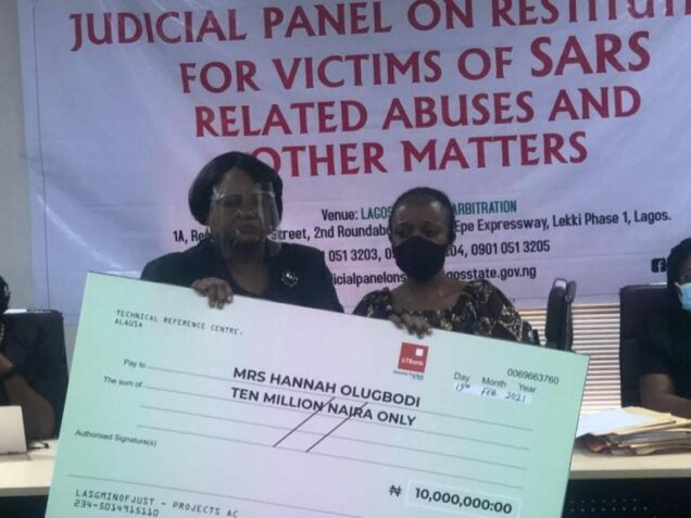 File: Lagos Judicial Panel presents cheque to a victim of police brutality