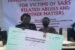 File: Lagos Judicial Panel presents cheque to a victim of police brutality