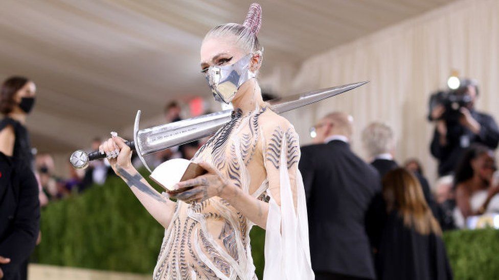 Grimes brought along a sword to the Gala